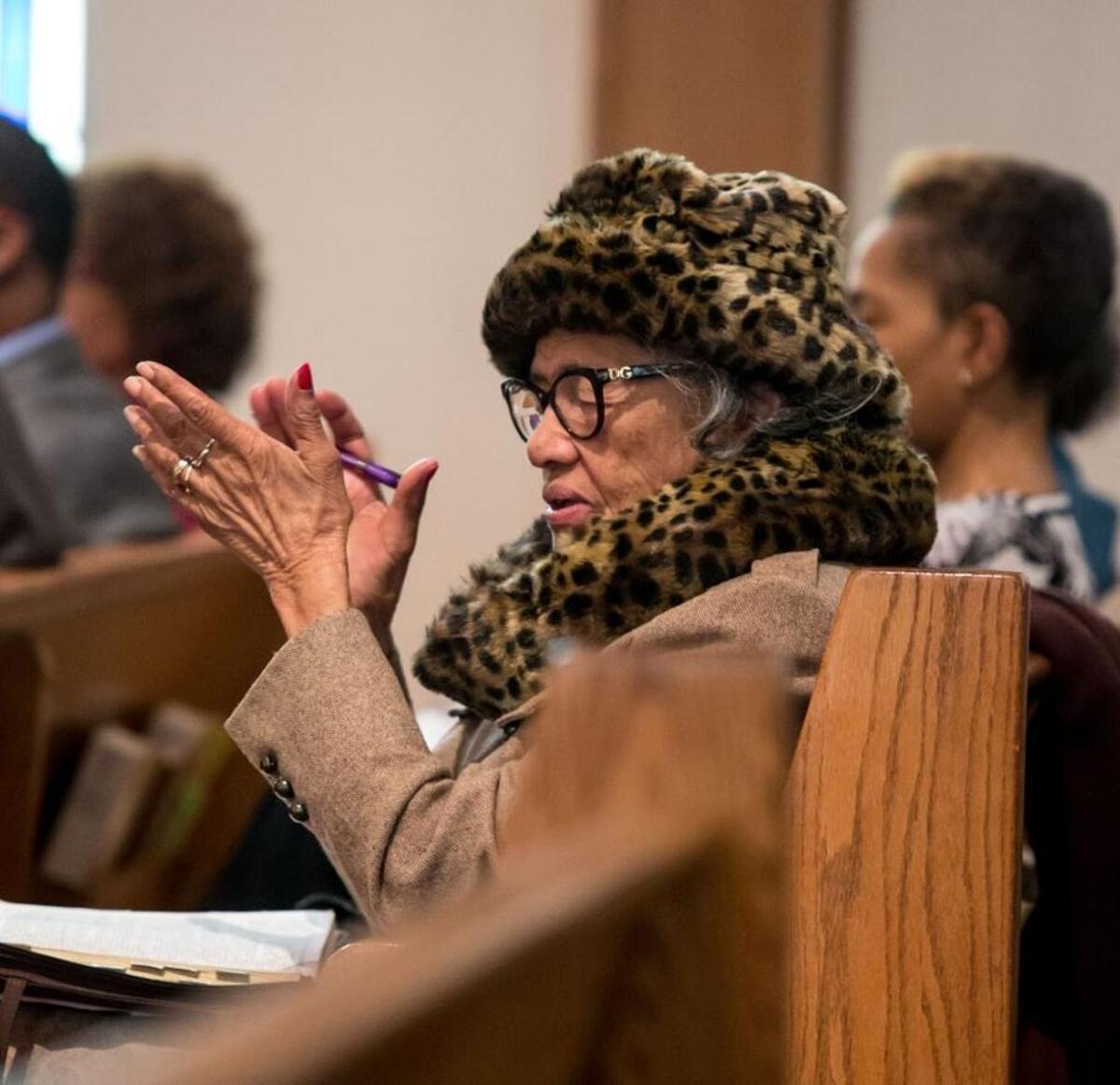 Vivian Samuel claps her hands in White Rock Baptist Church.