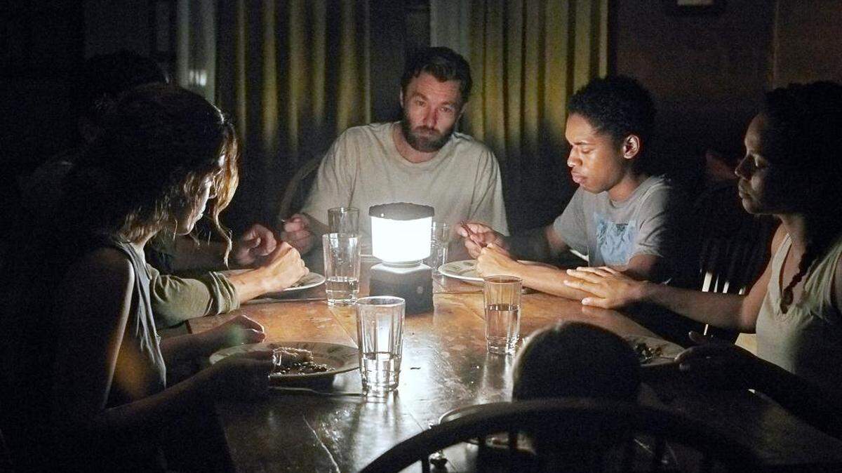 Riley Keough (left), Christopher Abbott, Joel Edgerton, Kelvin Harrison Jr., Carmen Ejogo and Griffin Robert Faulkner in "It Comes at Night."