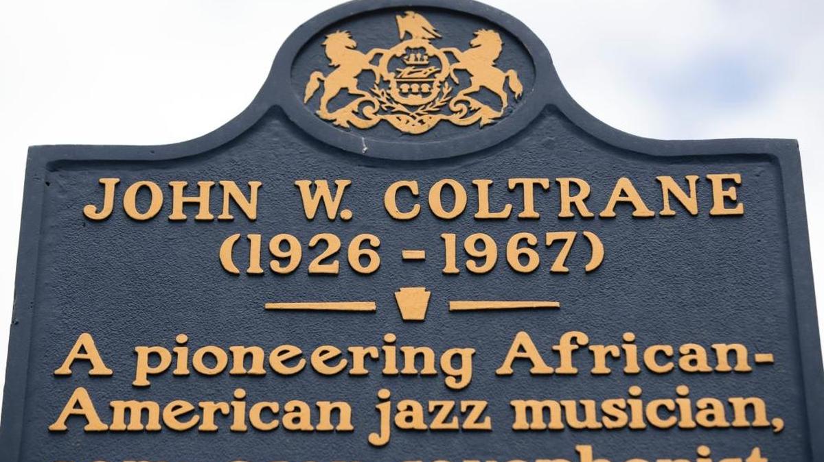 This May 8, 2017 photos shows an historic marker posted outside the former home of jazz musician John Coltrane in Philadelphia, Monday, May 8, 2017. Philadelphia has a rich musical legacy: It's birthplace of the lush acoustic style known as The Sound of Philadelphia and the hometown of "American Bandstand" and Chubby Checker's "Twist." But there's no major museum or other place of pilgrimage for music fans that encompasses the city's music history.