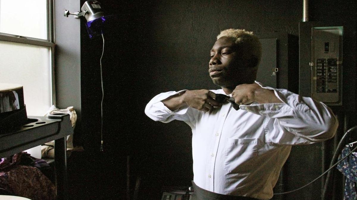 Actor Lazarus Simmons adjusts his bowtie backstage before rehearsal Monday, May 8, 2017, in Walltown Children's Theatre's new black box theater on Berkeley Street. The Little Green Pig Theatrical Concern will present the first show in the theater, "Hunchback," an original musical entertainment at 8 p.m. Thursday-Saturday, May 11-20. "It's about the arbitrariness of ugliness and beauty," says director Jaybird O'Berski.