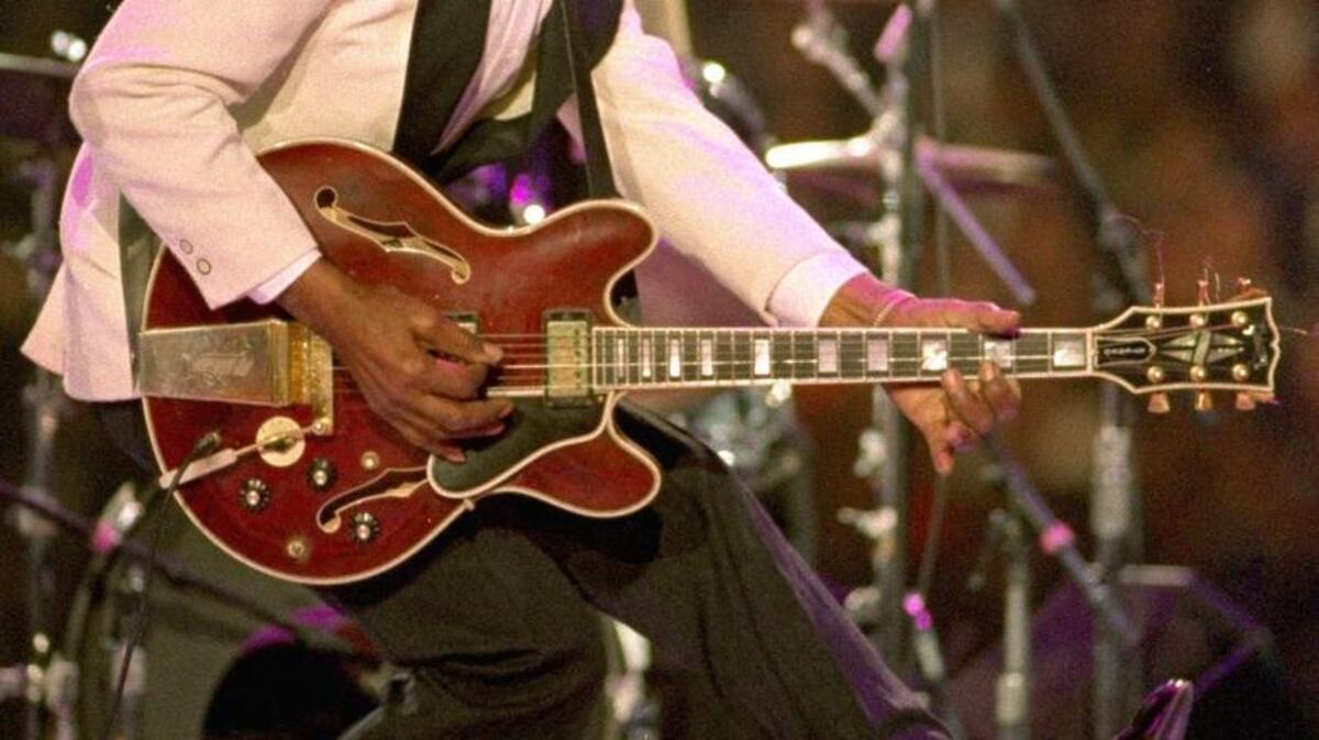 In this Jan. 19, 1993 file photo, Chuck Berry dances on stage at the Presidential Gala for President-elect Clinton and Vice President Al Gore in Landover, Md. Berry died March 18, 2017 at the age of 90. His last album, "Chuck," will be released on Friday, June 9, a fitting finale from the man who melded blues, rhythm and blues and country music into a sound that changed the cultural landscape.