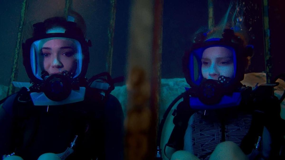 Lisa, played by Mandy Moore, and Kate, played by Claire Holt, are stuck at the bottom of the ocean floor after their shark-diving excursion goes terribly wrong in "47 Meters Down."