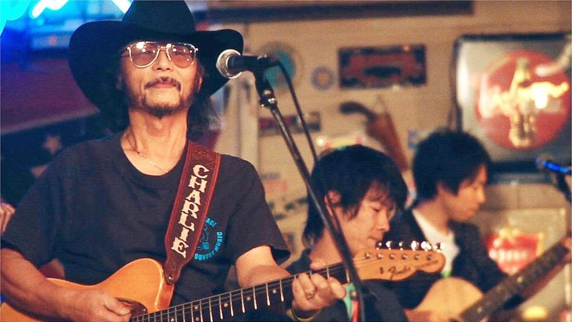 Charlie Nagatani sings at his country music bar in the documentary “Far Western,” one of the new documentaries to be screened at the Full Frame Documentary Film Festival.