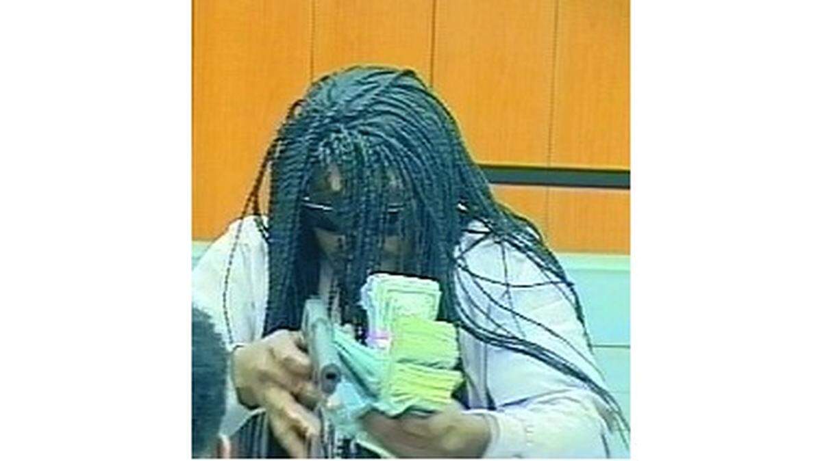 A security camera image of the man who robbed a Durham SunTrust located at 2008 E. N.C. 54.