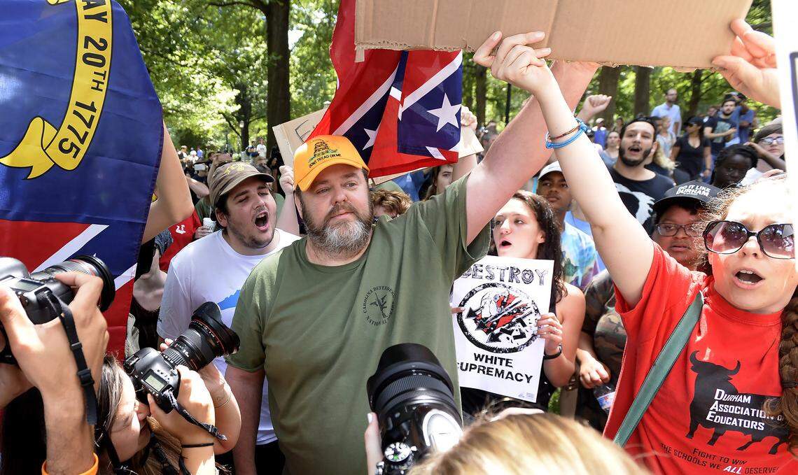 Protesters yell at supporters of Silent Sam as they leave McCorkle Place on the campus of UNC in Chapel Hill, N.C., Saturday, August 25, 2018. The rally included those for and against the removal of the controversial Confederate statue earlier this week. Several arrests were made.