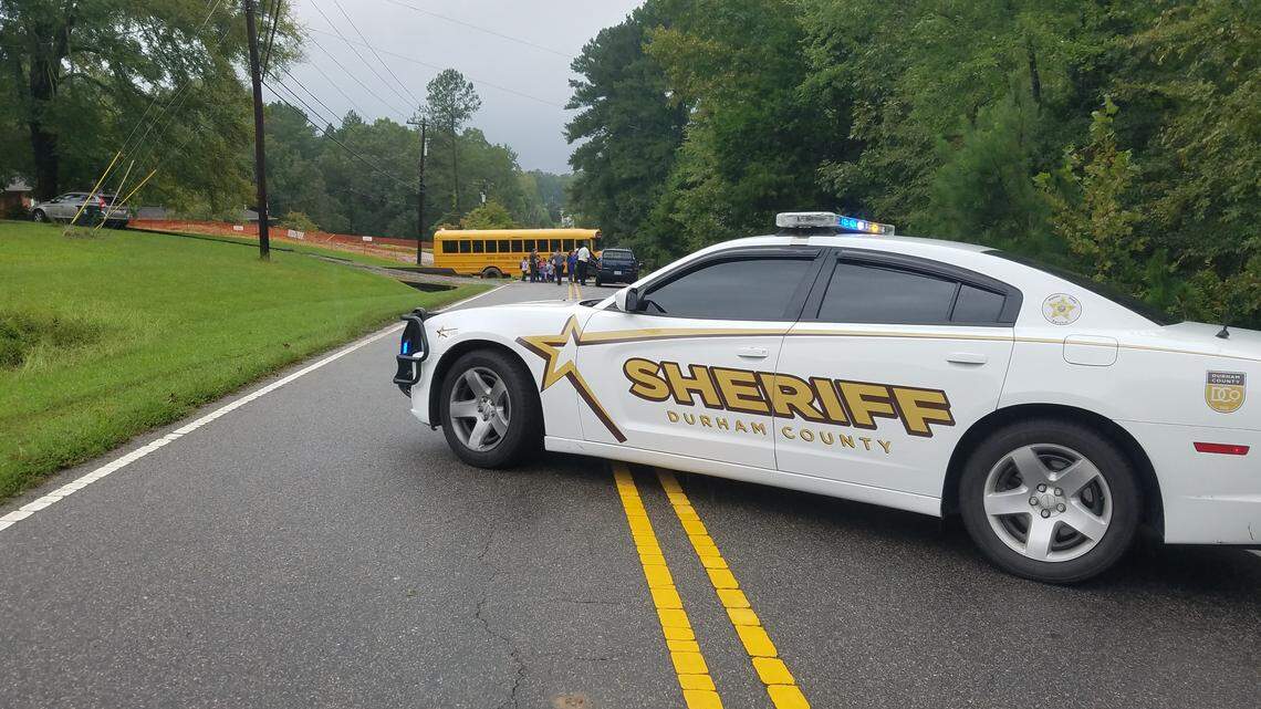 A Durham Public Schools school bus was stuck on Pickett Road the morning of Monday, Sept. 17, 2018, after it turned around to avoid the overflowing Mud Creek that covered the bridge and the road.  About a dozen students from Forest View Elementary were shuttled to school, a parent said.