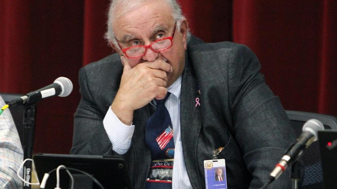 Steve Halkiotis, chairman of the Orange County Schools Board of Education, listens to speakers, most of them asking the board to ban the Confederate flag from school grounds, Monday, Feb. 27, 2017, at Stanback Middle School in Hillsborough, N.C. About 50 people signed up to speak at the meeting.