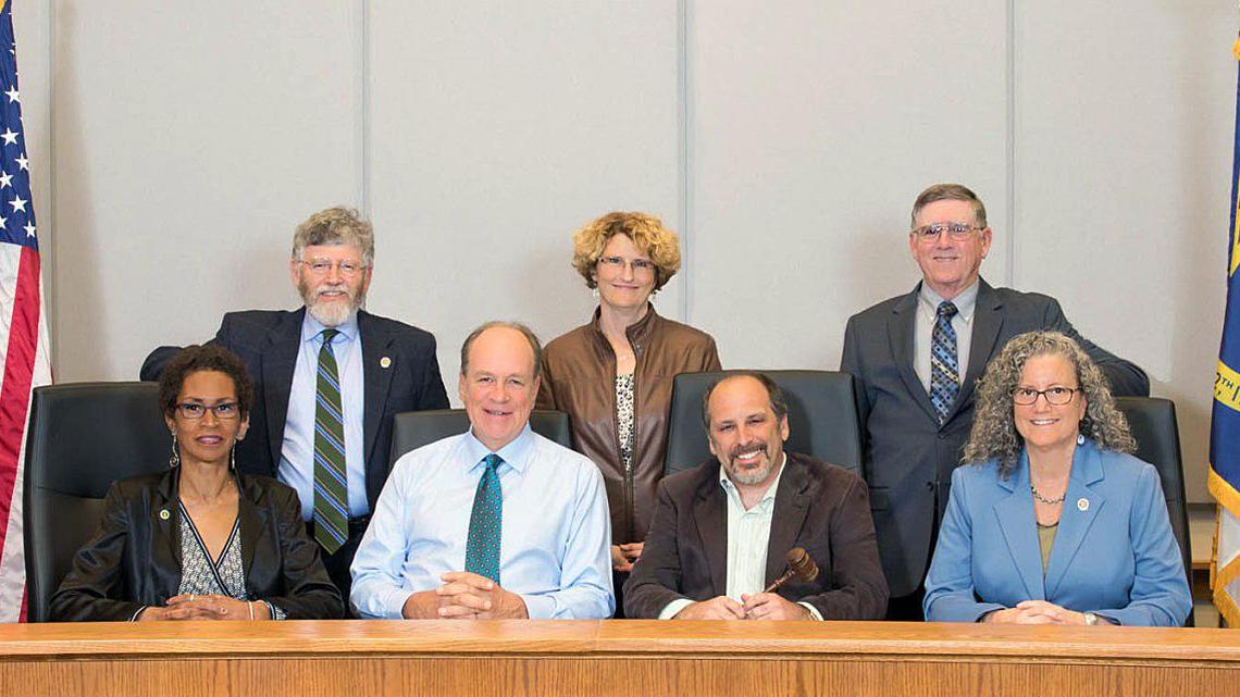 The Orange County Board of Commissioners - Barry Jacobs (clockwise from top left), Mia Burroughs, Earl McKee, Renee Price, Mark Marcoplos, Chairman Mark Dorosin and Vice Chairwoman Penny Rich - are weighing the size of a property tax increase for next year.