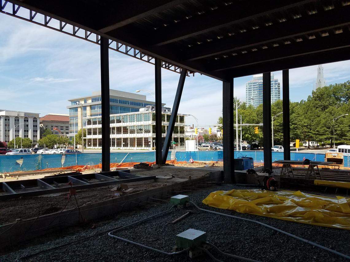 The view of downtown Durham from the first floor of the Durham County Main Library, under renovation. The closest building is the Durham County Board of Elections. One City Center and the steeple of Trinity United Methodist Church can be seen in the distance on the right.