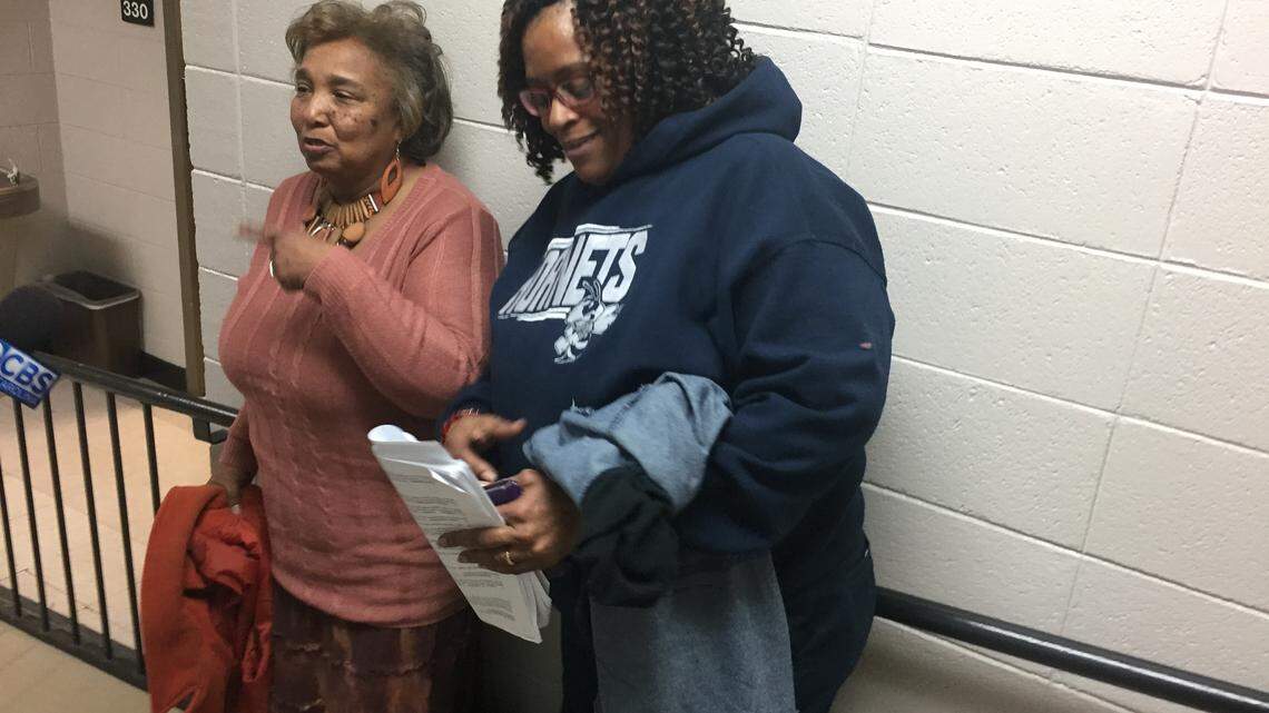 Deborrah Bailey, (left) a custodian employed SSC Service Solution and Denise Wiggins, a custodial supervisor at Hillside High School employed by Premiere, a subcontractor of SSC Service Solutions, celebrate the decision by the Durham school board Thursday, March 8, to move the district's custodial services in-house.