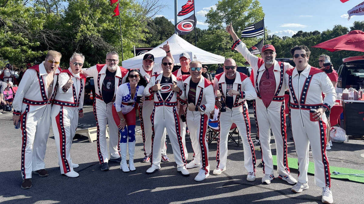 The CaneEvels, a group of Carolina Hurricanes season ticket holders, sport their iconic Evel Knievel outfits and custom red capes while tailgating outside Lenovo Center before Game 1 of the Stanley Cup Final against the Vegas Golden Knights on Tuesday, June 2, 2026.