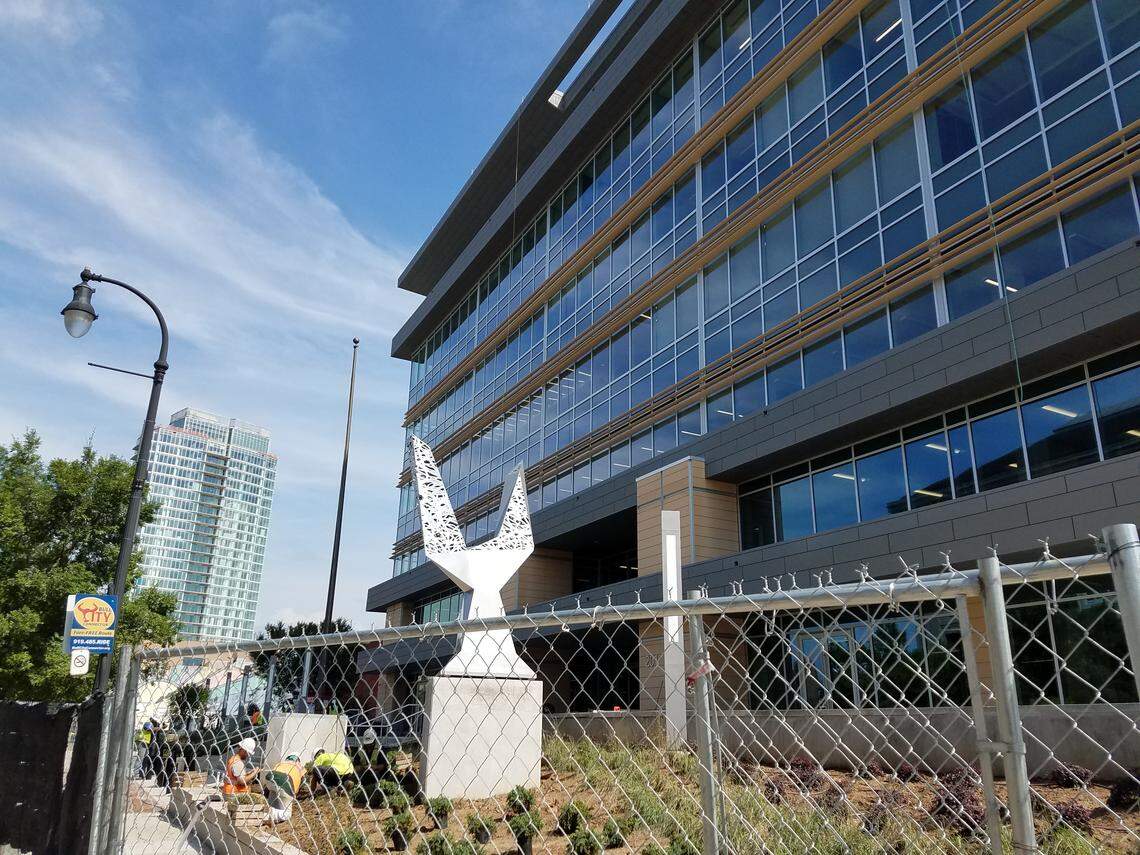 The old courthouse has been renovated and will reopen this summer as Durham County Administration Building II. The public art on the East Main Street side of the building is called The Taurus.