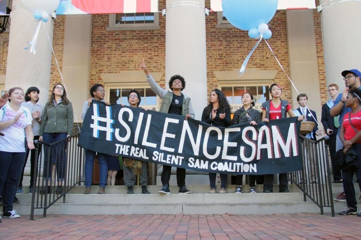 Members of The Real Silent Sam Coalition placed a black garment on the barrel of the statue's gun Monday, Oct. 12, 2015. The skirt symbolized the skirt that industrialist Julian Carr said at the statue's 1913 dedication hung in shreds after he "horsewhipped a Negro wench" for insulting a Southern lady on the street. Between 30 and 40 members of the coalition marched from McCorkle Place to Memorial Hall where they briefly disrupted the University Day proceedings to decry the memorial to Confederate soldiers of the university and racism they say persists on campus.