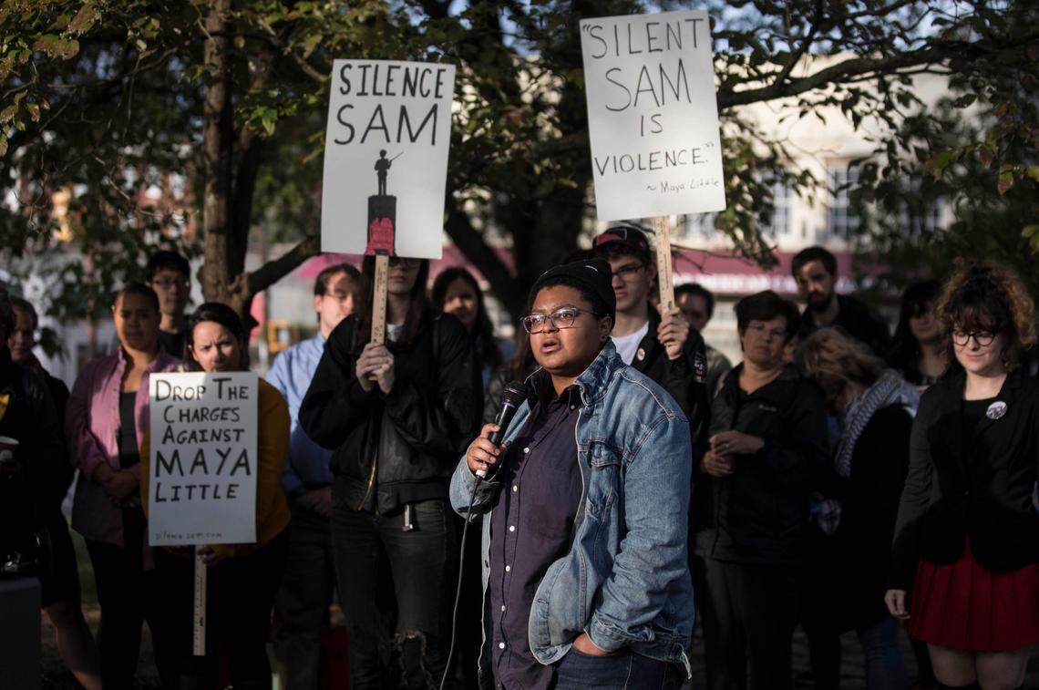 Maya Little, surrounded by anti-racist demonstrators supporting her, addresses reporters outside of the Orange County Courthouse on Monday, Oct. 15, 2018 before her first appearance in court. 