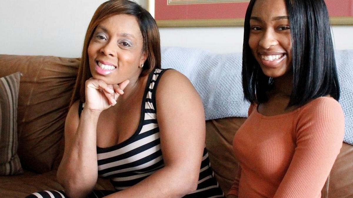 Iisha Brown, left, and her daughter, Olivia Brown, 17, pose for a photo in their Charlotte living room Thursday, June 1, 2017 in Charlotte, N.C. Because Olivia Brown lives in North Carolina, she was charged as an adult for a school fight last year, and now worries that with a criminal record, her chance at a successful life is ruined.