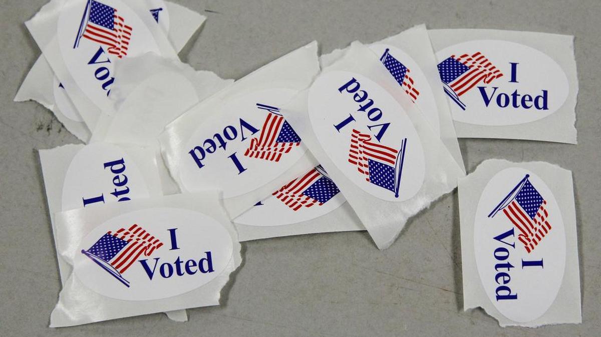 Voters get a sticker to encourage others to vote.