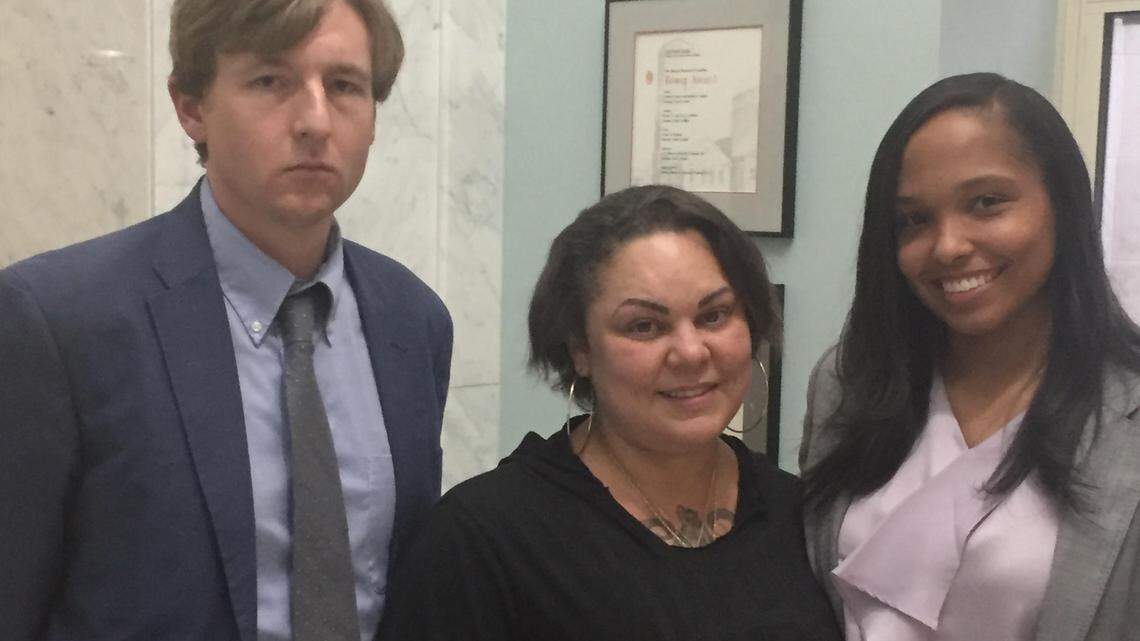 Julia Graves, (center) the mother of Uniece “Niecey” Fennell, attended a Durham County public hearing Monday, June 11, where her attorneys Ian Mance (right) and Whitley Carpenter (left) called on County Commissioners to fund jail improvements to ensure the safety of children charged as adults.