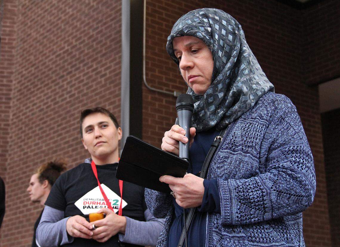 Manal Sidawi, who was born and raised in Kuwait, speaks at a rally outside Durham City Hall on Monday, April 16, 2018, opposing police training partnerships with Israel. Sidawi said she was in solidarity with Palestinians, as well as African Americans in the U.S. "They have been subjected to racism, oppression and violence on a daily basis" she said. "We are here to stop that."