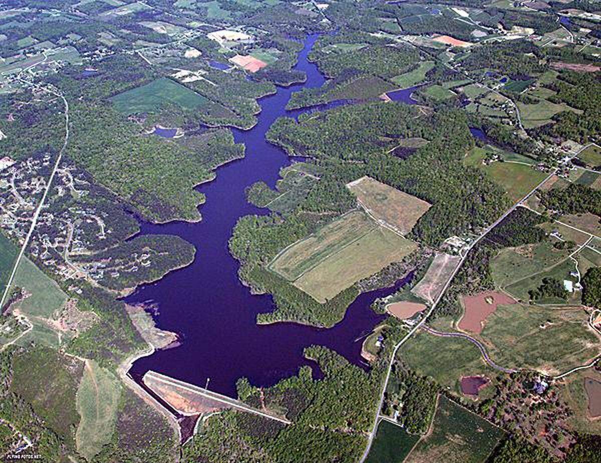 Work started in late March 2018 to expand the West Fork Eno Reservoir in Cedar Grove, north of Hillsborough. The reservoir's dam can be seen in the bottom center of this photo. The auxiliary spillway, filled with water when the photo was taken, is to the dam's left.