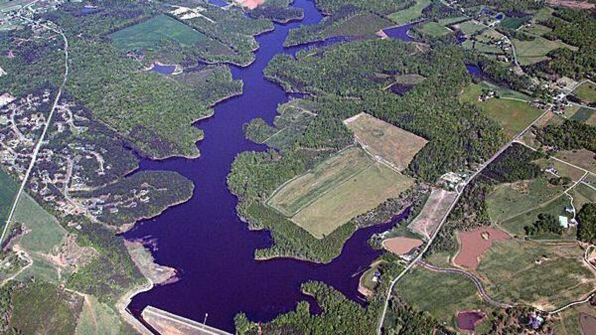Work started in late March 2018 to expand the West Fork Eno Reservoir in Cedar Grove, north of Hillsborough. The reservoir's dam can be seen in the bottom center of this photo. The auxiliary spillway, filled with water when the photo was taken, is to the dam's left.