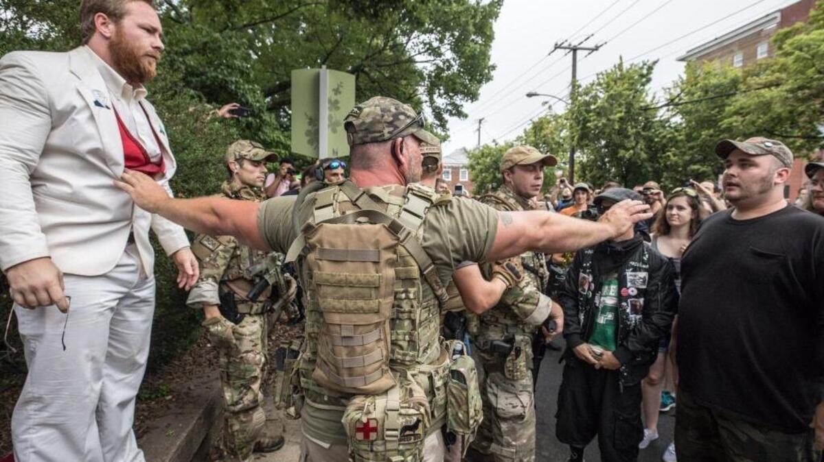 A member of "The Militia" keeps the peace outside the Unite the Right rally on Saturday in Charlottesville, Va.