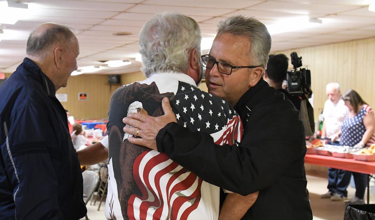 Durham County Sheriff Mike Andrews is greeted by a well wisher at his election gathering at the Town &Country Sportsman's Club in Durham, N.C. Tuesday, May 8, 2018.