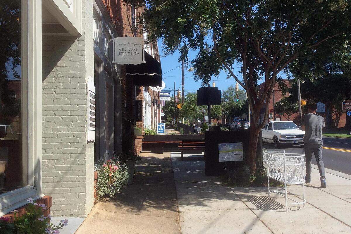 A low cedar planting wall surrounds two sides of the outdoor dining area at Panciuto restaurant on North Churton Street in Hillsborough. Some Town Board members and residents have said they expected sidewalk dining barriers to be more opaque.