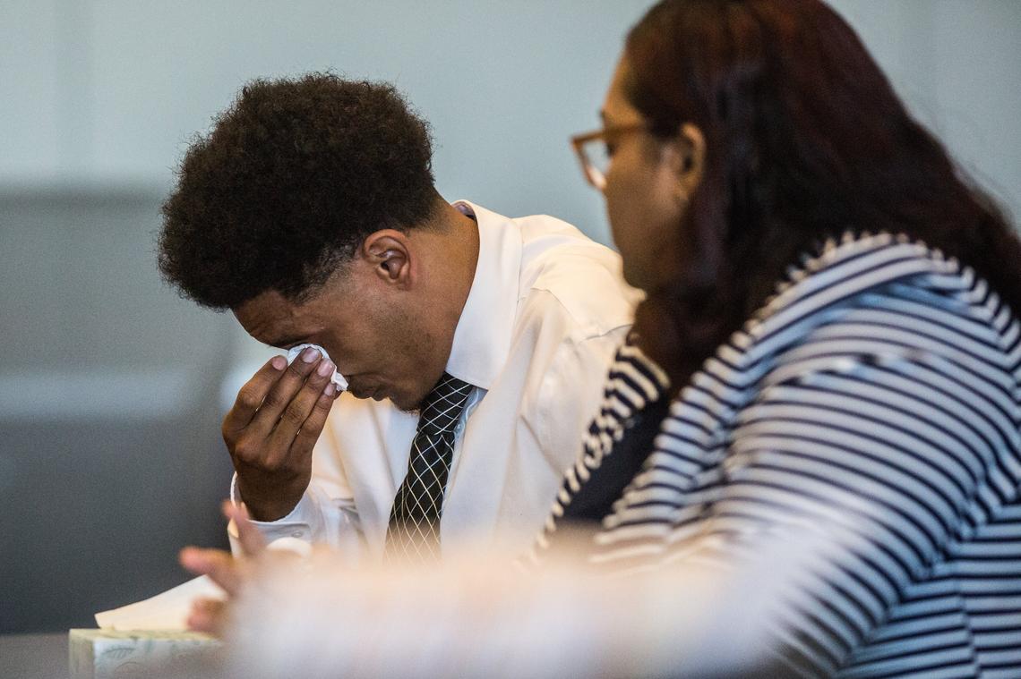Defendant James Berish wipes tearsas his attorney Nisha Williams looks on Thursday, April 5, 2018 during a restorative justice hearing at the Durham County Justice Center. Berish was charged with shooting a 10-year-old in May 2017 after his gun accidentally went off in his apartment.