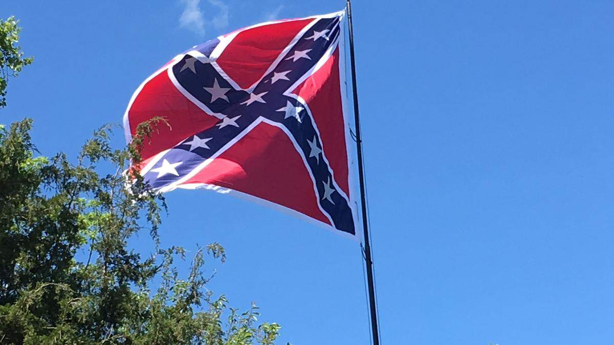 A Confederate flag flies over Highway 70 in Orange County, North Carolina.