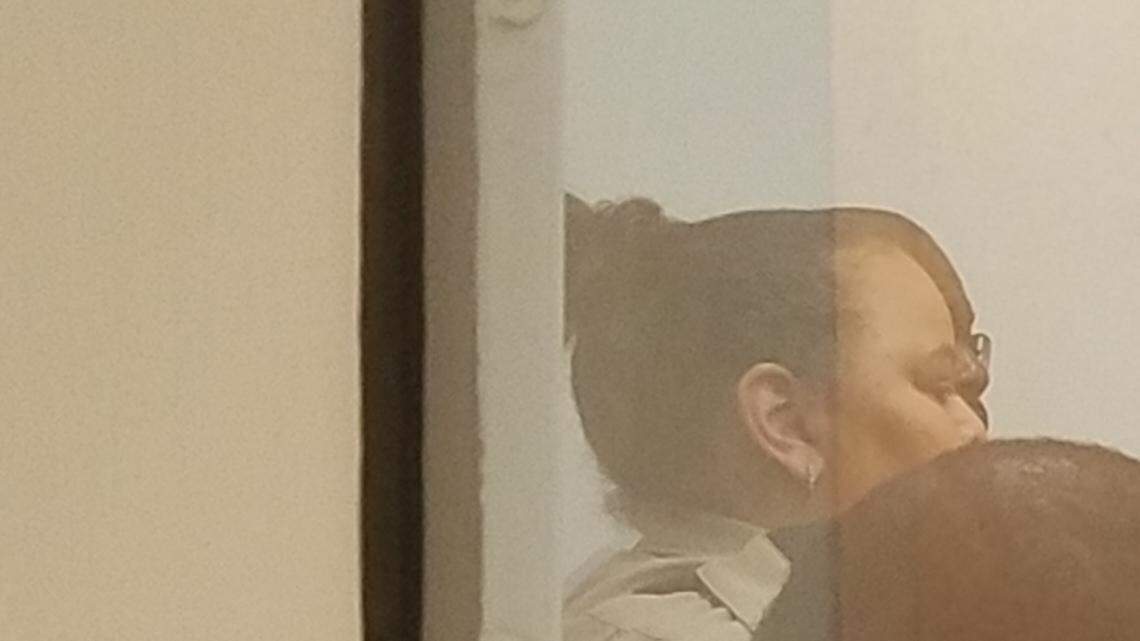 Tomaris Parker, in orange, is charged with second-degree murder after he led police on a chase that ended in a crash that killed 24-year-old Durham County detention officer.  On right, Durham County Sheriff Mike Andrews and Orange County Sheriff Charles Blackwood attended Parker’s first appearance hearing Monday, Aug. 6, 2018.