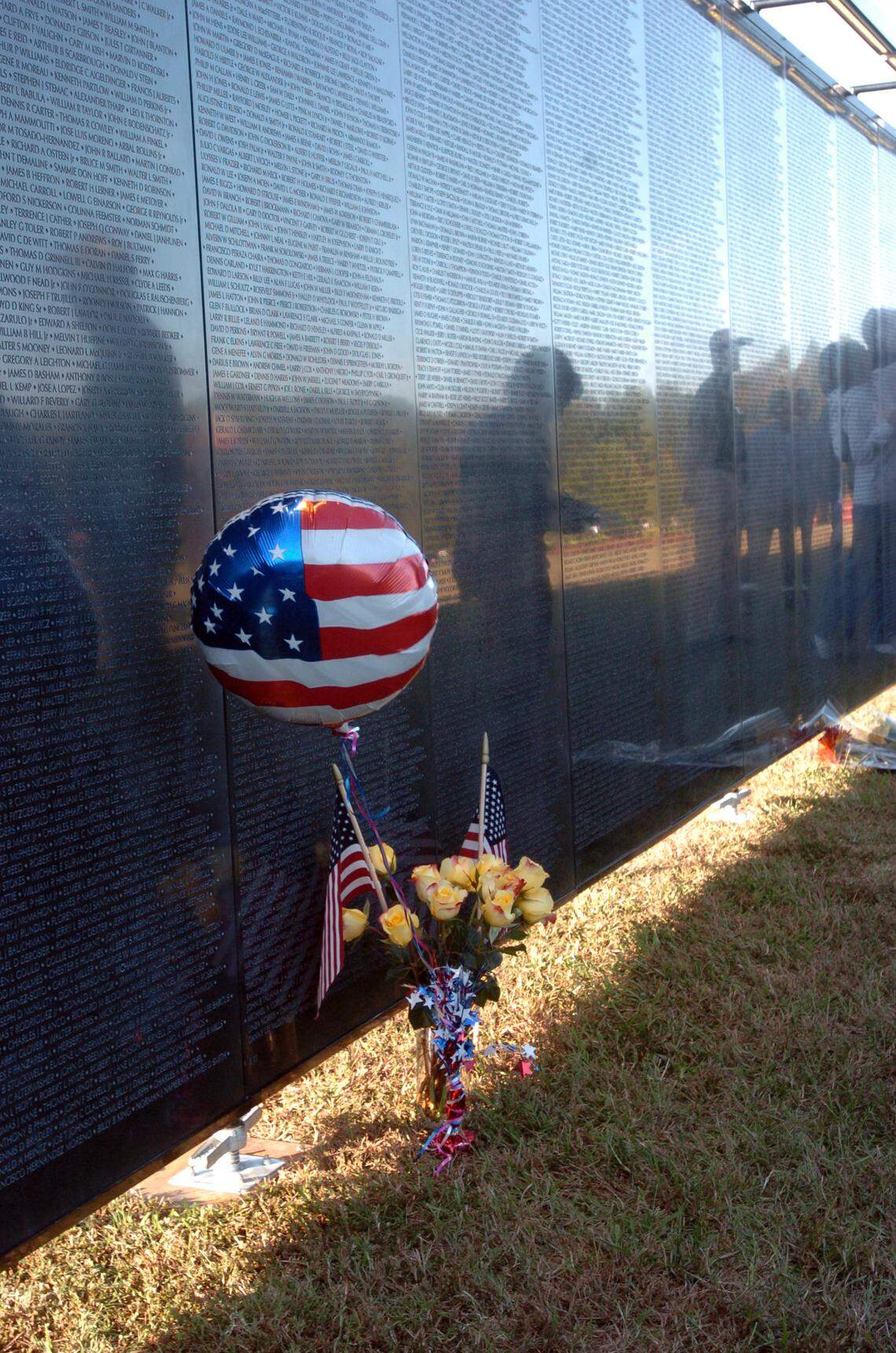 A balloon was left at the base of the Wall that Heals exhibit in Wake Forest in 2018 when the three-quarter scale replica of the Vietnam Veterans Memorial made a four-day stop at Joyner Park. The exhibit will be in Garner March 29 to April 3.