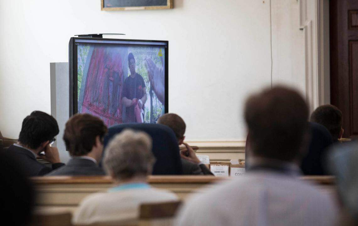 Video evidence of Maya Little defacing Silent Sam, from Lt. Jeffery Mosher’s body camera, is shown to the court on Monday, Oct. 15, 2018.