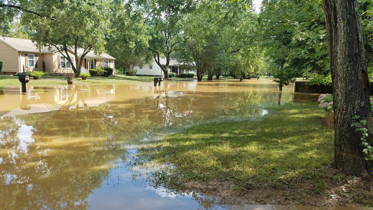 Some streets in the Old Farm neighborhood in northern Durham near the Eno River were flooded on Monday Sept. 17, 2018 and emergency officials helped evacuated people from their homes.