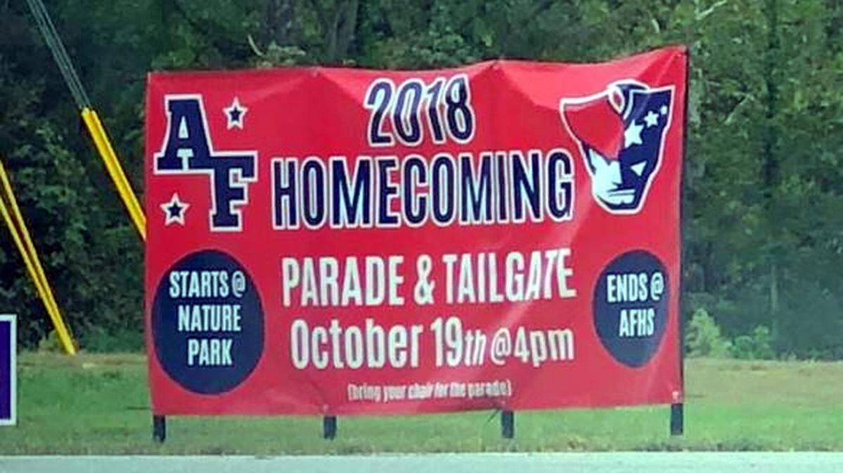 A banner near Apex Friendship High announces the school’s first homecoming celebration and parade set for Friday.