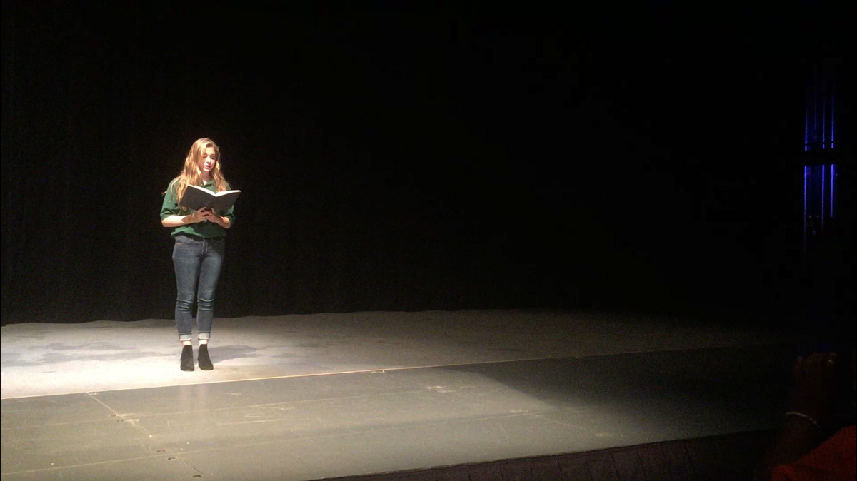 Carrboro High School junior Mia Spadavecchio reads from "A Poem for Sandy Hook," Friday night during the production of "A Night for the Fight Against Gun Violence."