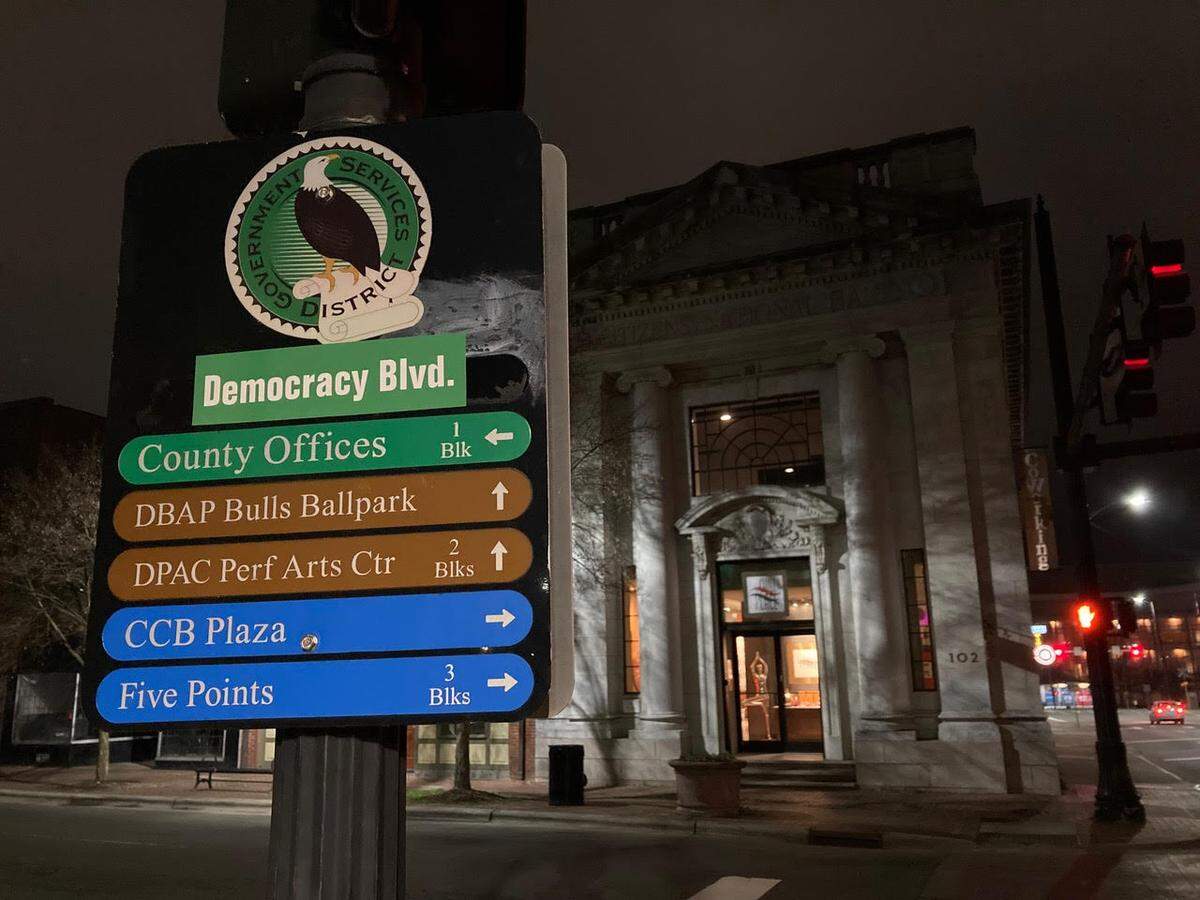 A green “Democracy Blvd.” sticker spotted at Main and Mangum streets in downtown Durham.