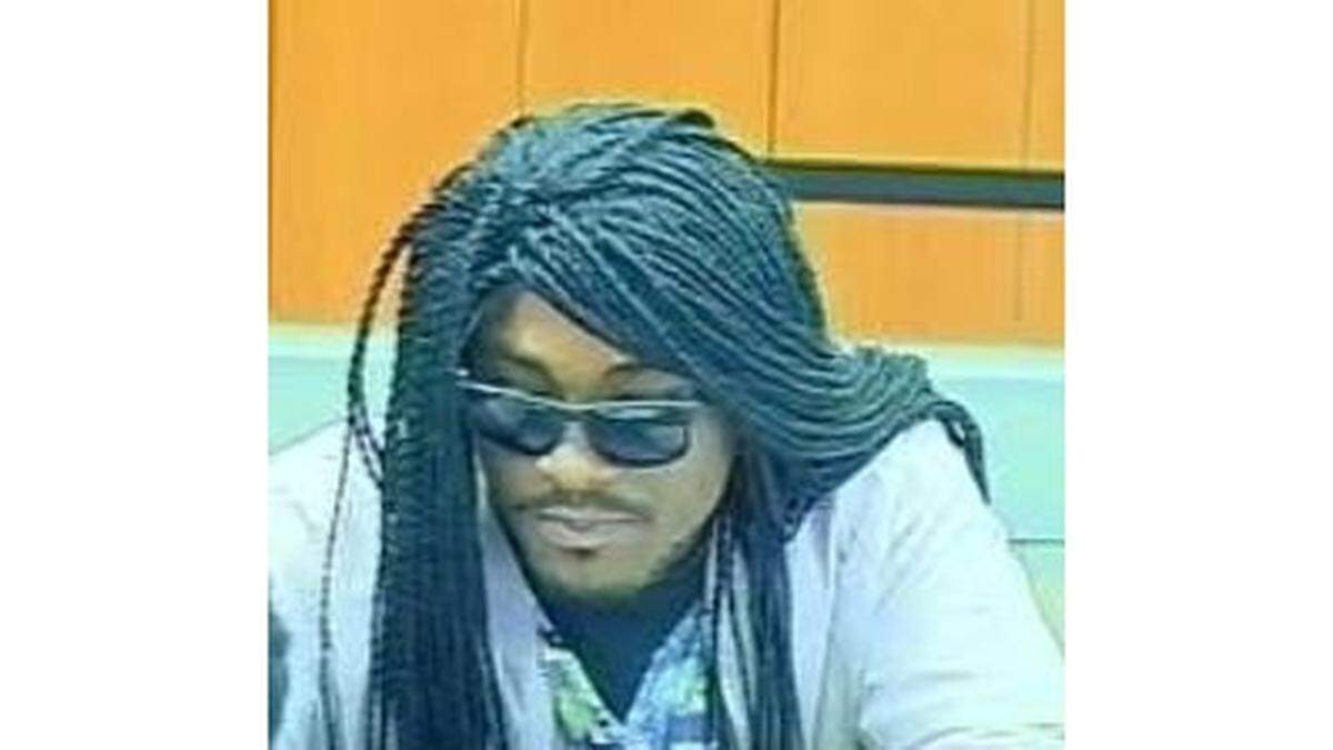 Investigators have requested the public's assistance finding a bank robber, seen here in a security camera image.