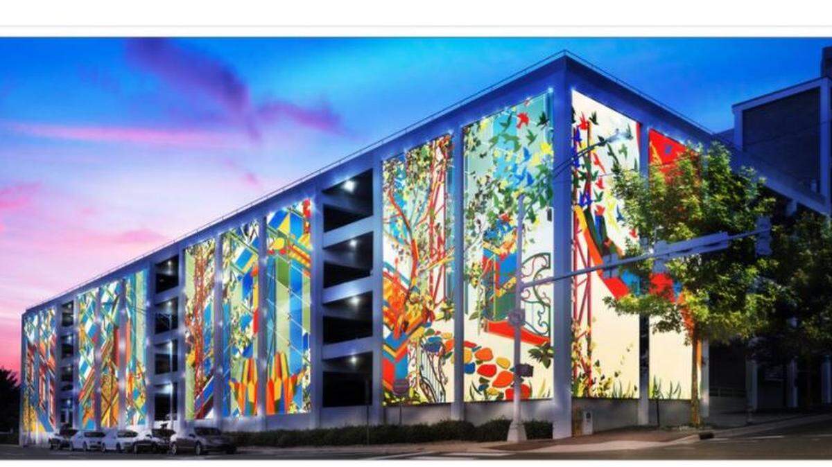 What the public art panels on the Corcoran Street parking deck will look like at night.