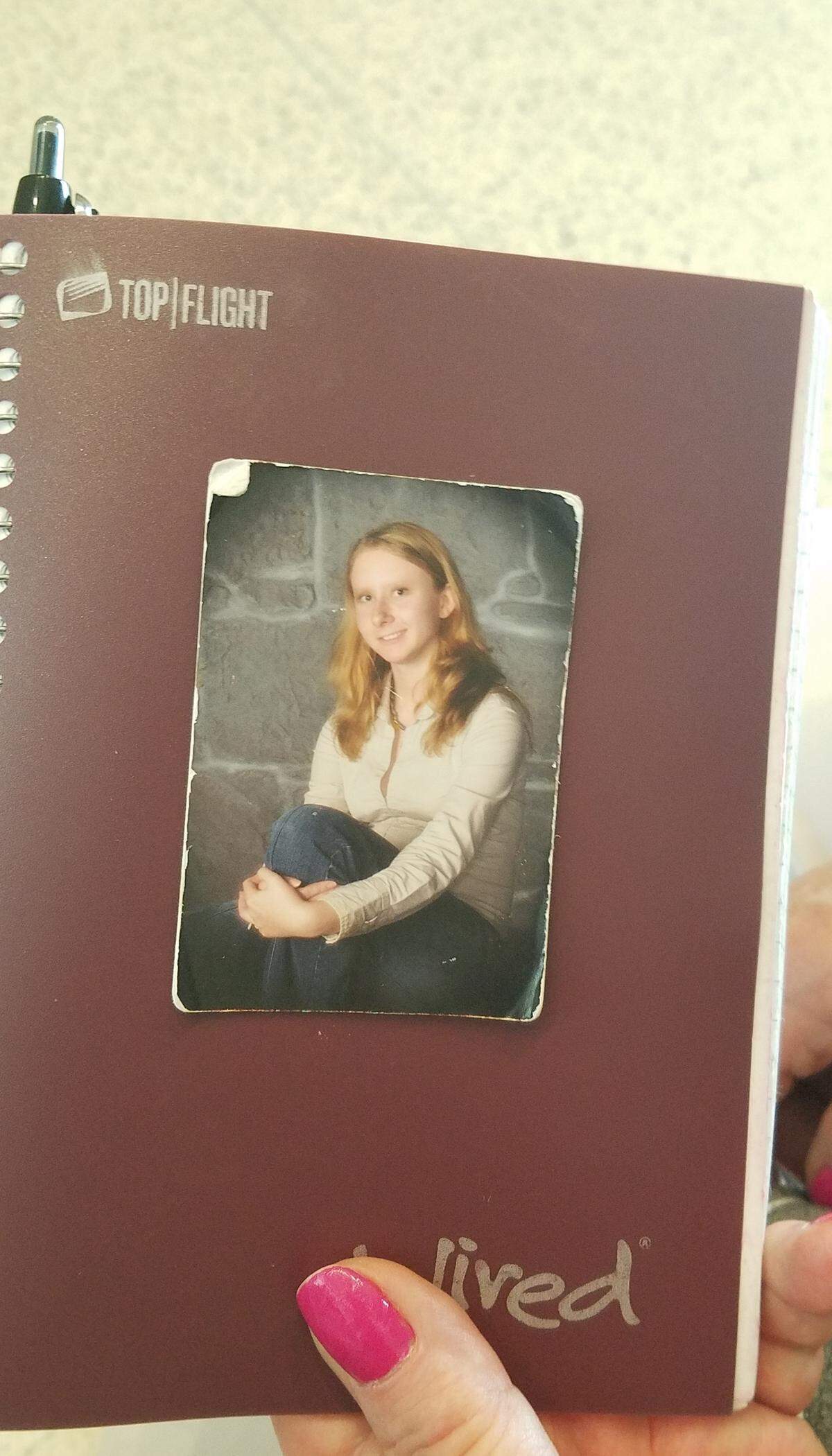 A photo of the notebook that Linda Brown, 71, brings to court hearings for the two men charged with killing her 25-year-old granddaughter Kourtney Krista Dawson in February 2014.