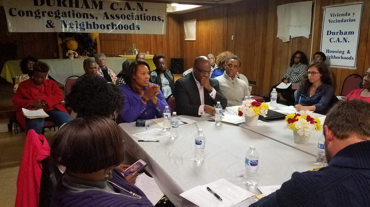 Left to right: Durham City Council member DeDreana Freeman, in purple, talks to Durham CAN leaders along with Council member Mark-Anthony Middleton and Council member Vernetta Alston on Wednesday, March 21, 2018 at First Chronicles Community Church.