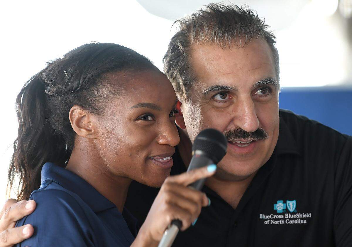 NC Courage player Crystal Dunn and Fernando Fiore, Argentinian sports anchor help Durham Parks and Recreation dedicate another futsal pitch on repurposed tennis courts at East End Park on North Alston Avenue, Tuesday, Oct. 30, 2018. Kids were able to play a short exhibition game in front of an enthusiastic crowd.