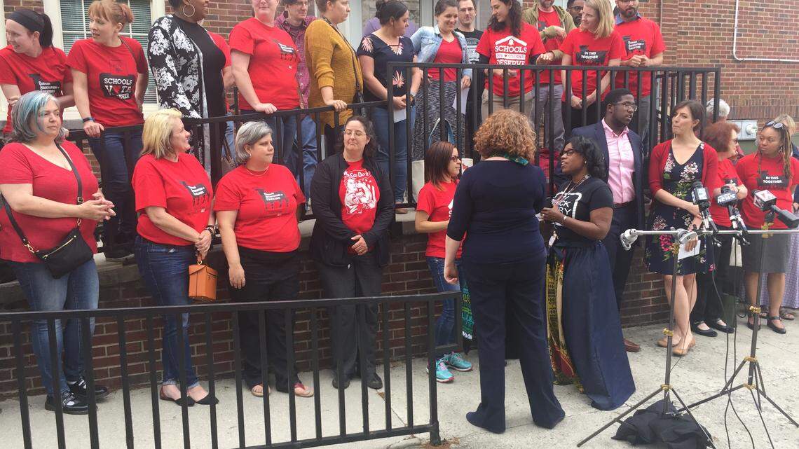 Teachers rally in front of the Fuller Administration Building to ask the Durham school board to cancel classes May 16 so they can go to Raleigh to advocate for public education.