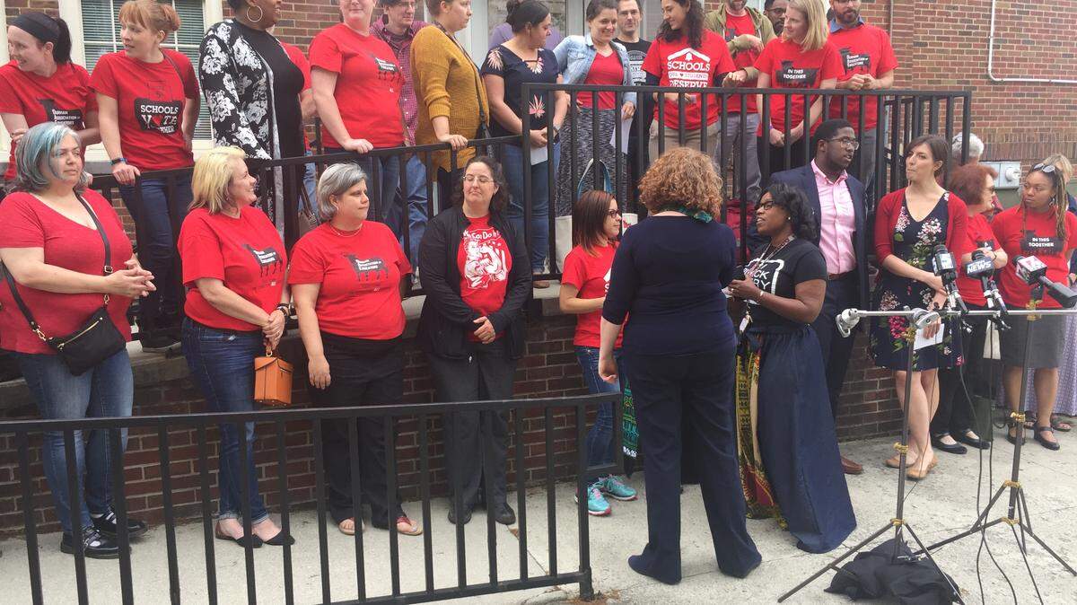 Teachers rally in front of the Fuller Administration Building to ask the Durham school board to cancel classes May 16 so they can go to Raleigh to advocate for public education.