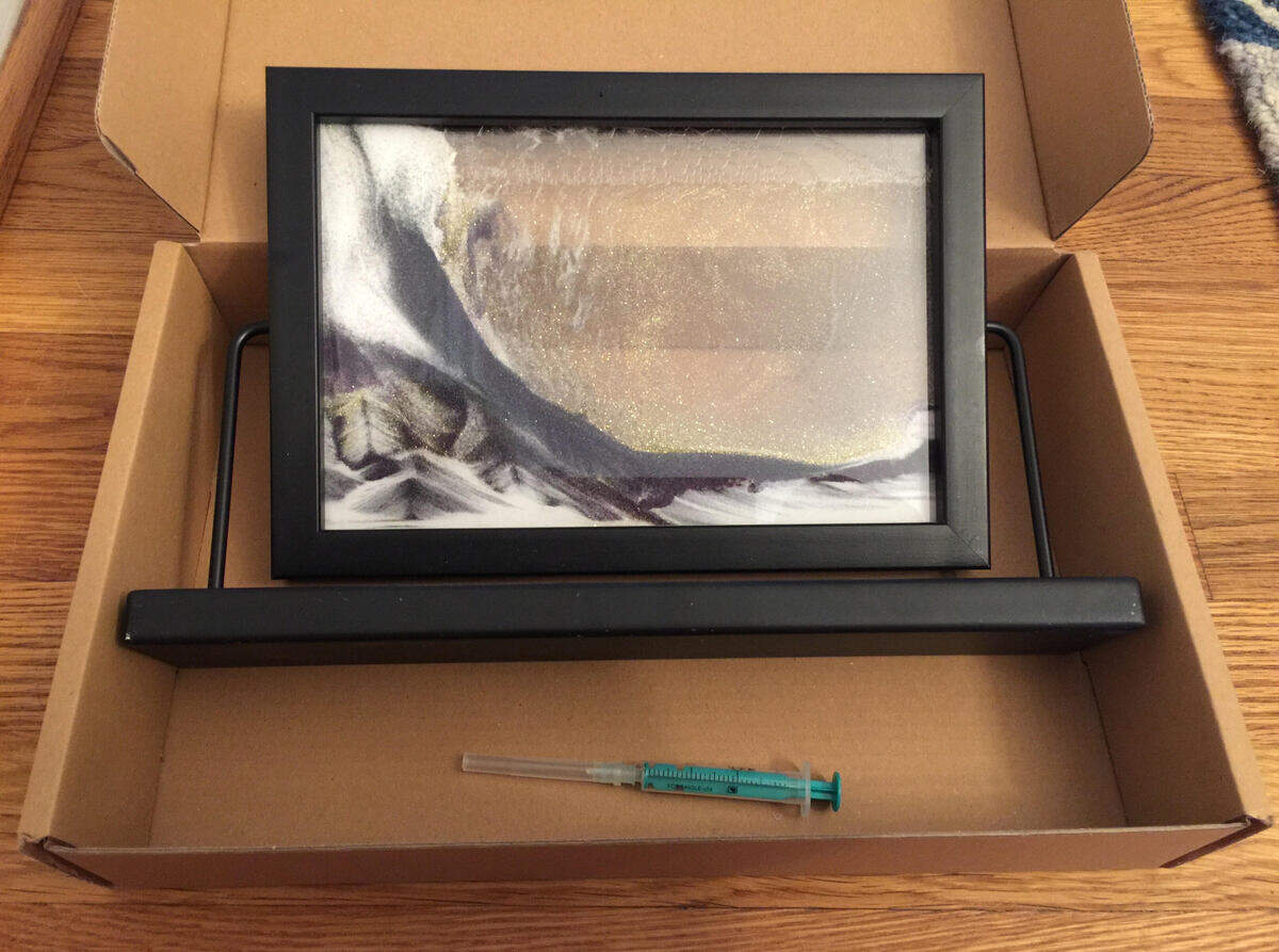 A photo of the sand vision toy that was given to both of Bill Bishop’s sons by Julie Seel. In July, police collected as part of the homicide investigation the needle from the toy in the 16-year-old’s room in his father’s home.