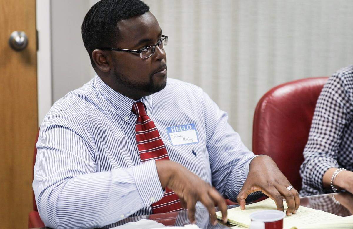 Jesse McCoy, attorney and faculty at Duke Law Civil Justice Clinic who also works on the Durham Eviction Diversion Program, speaks to the group at the Herald-Sun office on Tuesday, August 28, 2018.