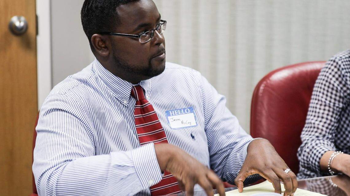 Jesse McCoy, attorney and faculty at Duke Law Civil Justice Clinic who also works on the Durham Eviction Diversion Program, speaks to the group at the Herald-Sun office on Tuesday, August 28, 2018.