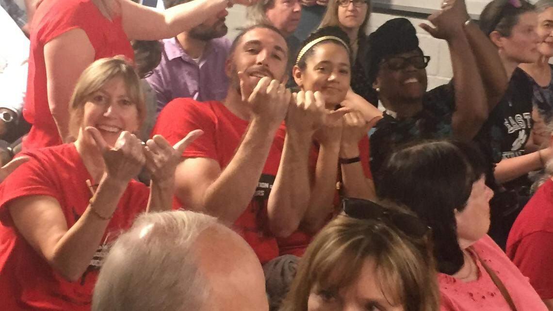 Members of the Durham Association of Educators joke around before the Chapel Hill-Carrboro school board meeting on Thursday, May 3. The DAE members attended the meeting to support Chapel Hill-Carrboro City School teachers, who asked the school board to cancel classes May 16 so they could go to Raleigh to lobby lawmakers for better working conditions and pay. The board unanimously approved the request.