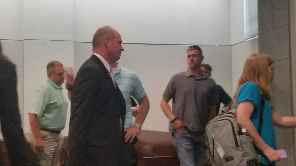 Keith King, center in the dark suit, was awarded more than $8.8 million on Thursday, July 26, 2018, after he sued his ex-wife’s lover for alienation of affection, criminal conversation and other claims.