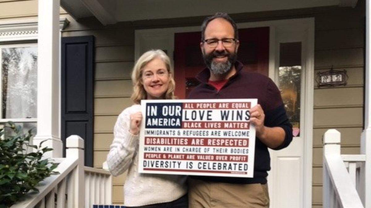 Sarah “Rah” Bickley and John O’Brien live in Woodcroft in South Durham. They were told to take down their “In Our America” sign from their yard, but not campaign signs.