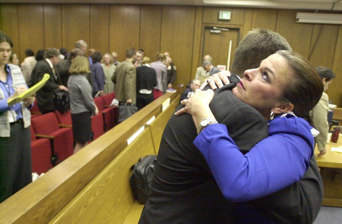FILE PHOTO: Durham asst. DA Freda Black, after just having hugged Durham DA Jim Hardin also embraced her colleague, asst. DA David Saacks after defendant Michael Peterson was read the jury’s guilty verdict and escorted from the courtroom in handcuffs on Oct. 10, 2003.